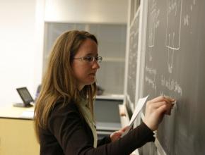 Teacher_writing_on_a_Blackboard.jpg