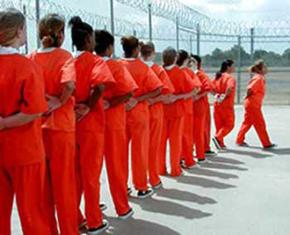 Incarcerated women on their way to an outdoor recreation area